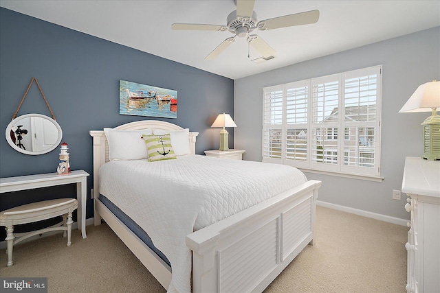 bedroom with ceiling fan, baseboards, visible vents, and light carpet