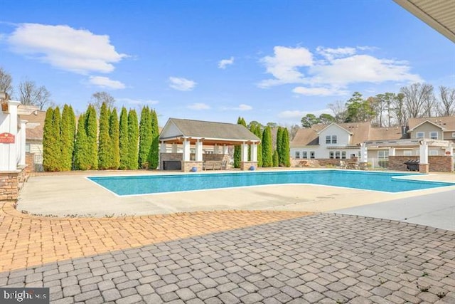 outdoor pool featuring a patio area