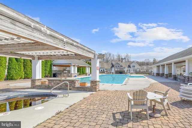 community pool featuring a patio area and a pergola