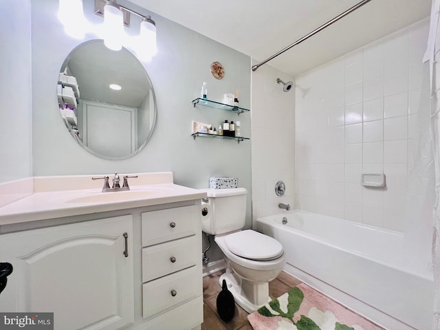 bathroom featuring vanity, shower / tub combo, and toilet