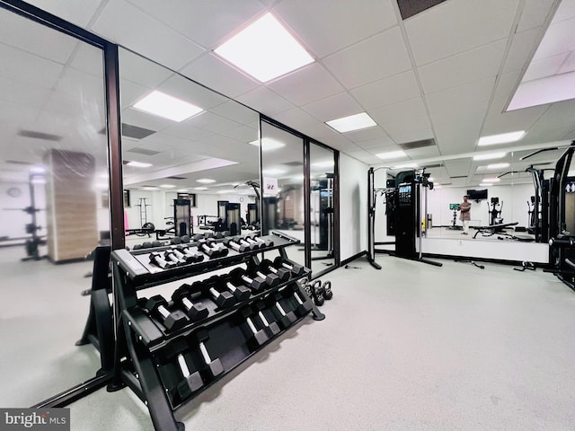 workout area with a paneled ceiling