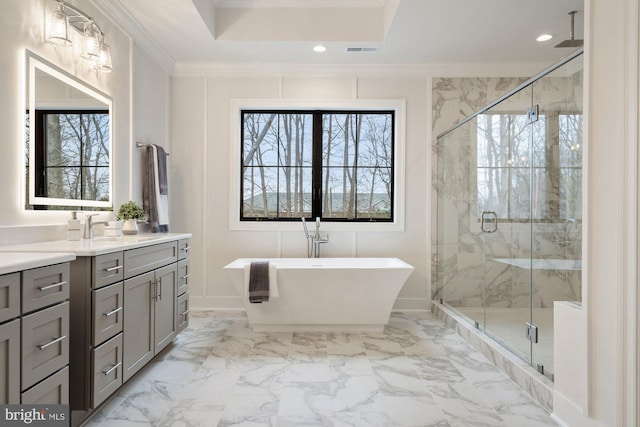 bathroom with a marble finish shower, visible vents, ornamental molding, a freestanding tub, and marble finish floor