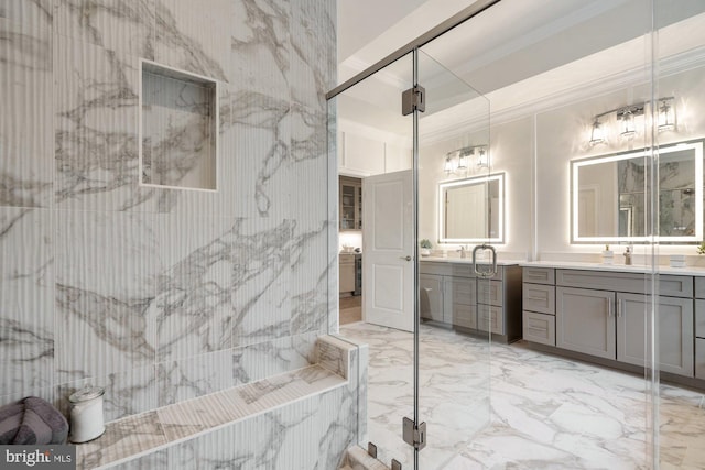 full bath with vanity, marble finish floor, and ornamental molding