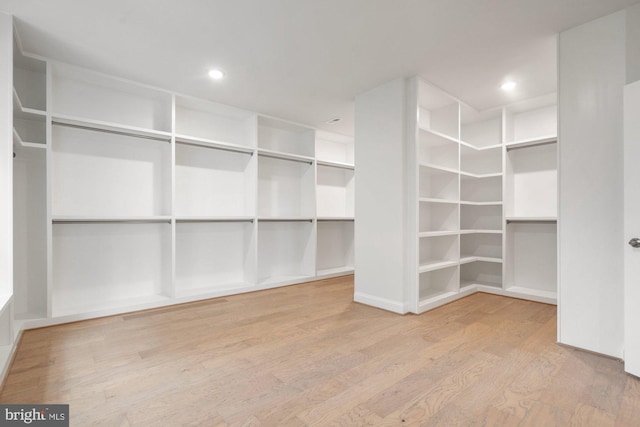 spacious closet with wood finished floors