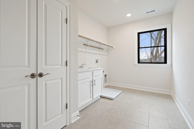 washroom featuring visible vents, baseboards, hookup for an electric dryer, and washer hookup