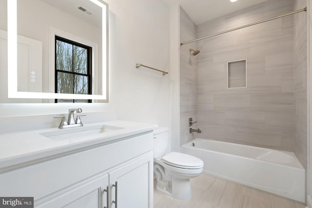 bathroom featuring washtub / shower combination, toilet, visible vents, and vanity