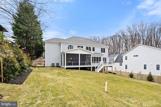 back of property with a shingled roof, fence, cooling unit, a yard, and a sunroom