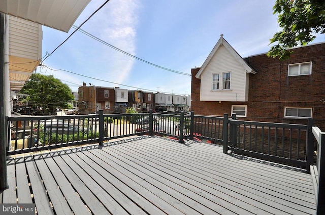 wooden terrace featuring a residential view