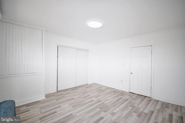 spare room featuring light wood-type flooring