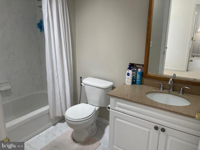 bathroom featuring shower / tub combo, toilet, vanity, and tile patterned flooring