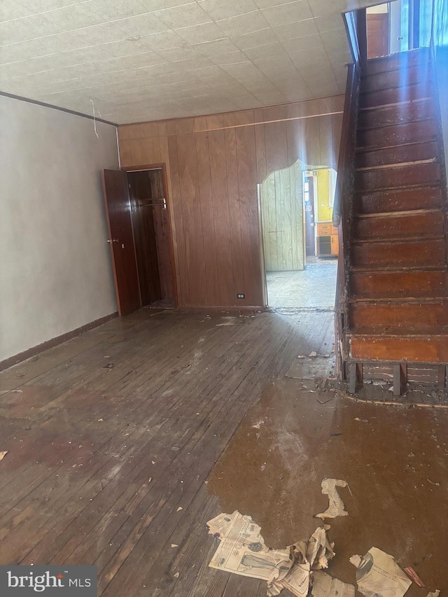 unfurnished room with hardwood / wood-style floors