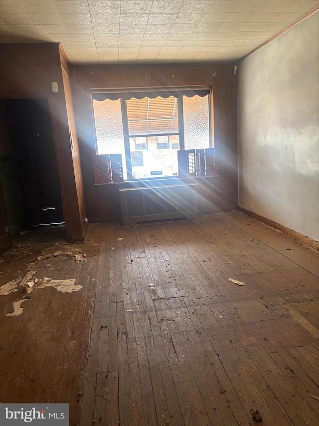 entrance foyer with hardwood / wood-style flooring and baseboards