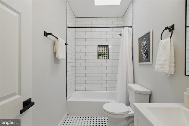 bathroom featuring tile patterned floors, shower / bathtub combination with curtain, toilet, and vanity