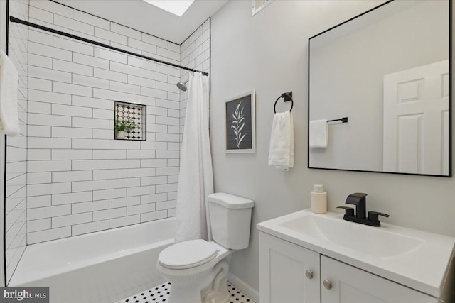 full bath featuring vanity, shower / bath combination with curtain, and toilet