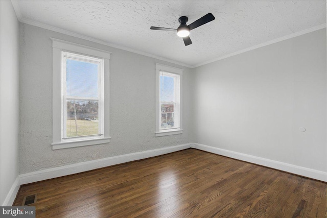 unfurnished room featuring visible vents, dark wood-style flooring, and crown molding