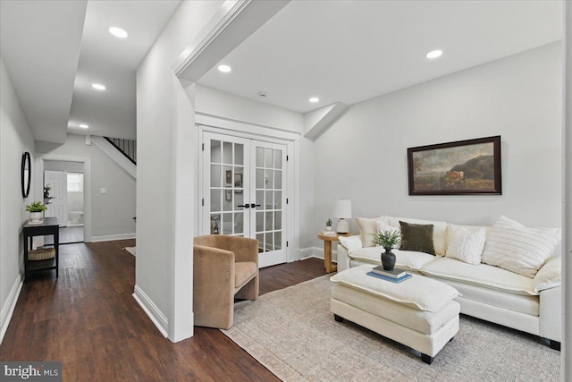 living area featuring recessed lighting, dark wood-style floors, baseboards, and french doors