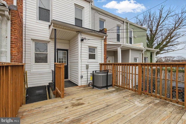 wooden terrace featuring central air condition unit