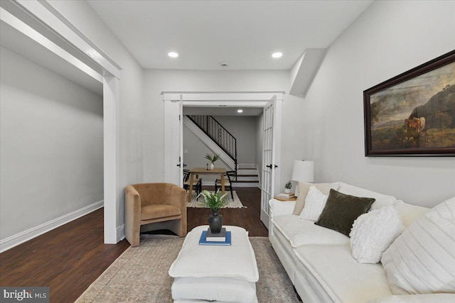 living room with stairway, recessed lighting, baseboards, and wood finished floors