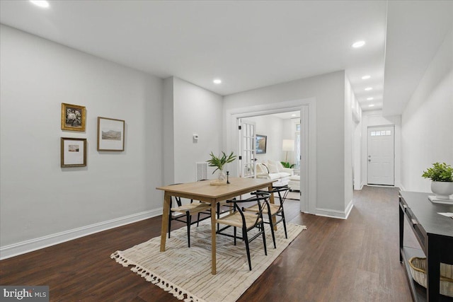 dining area with recessed lighting, baseboards, and dark wood-style floors