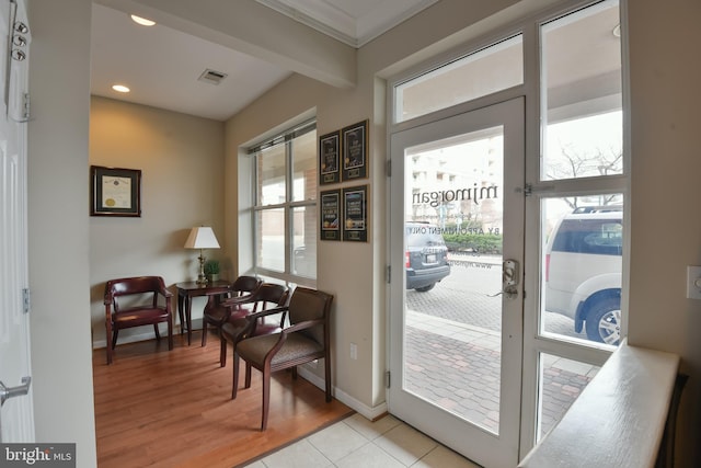 entryway featuring visible vents, beam ceiling, recessed lighting, light wood finished floors, and baseboards