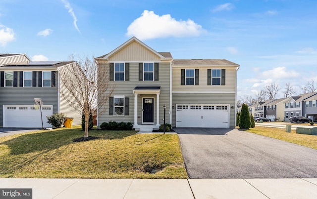 view of front of home featuring a front lawn, a residential view, a garage, and driveway