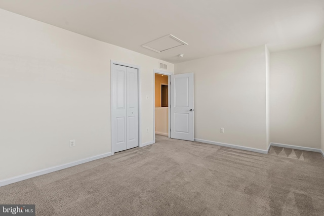 carpeted empty room with baseboards and visible vents