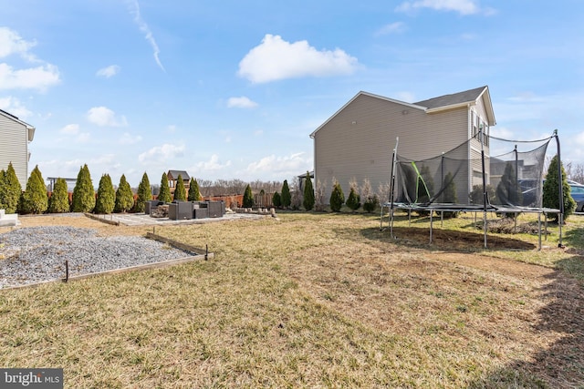 view of yard with a trampoline