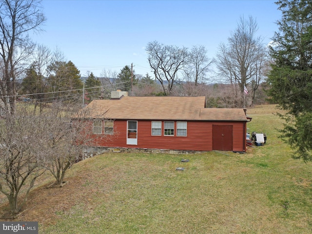 view of home's exterior with a yard