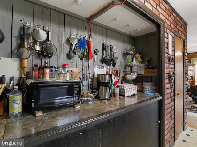 interior space with dark countertops and a toaster