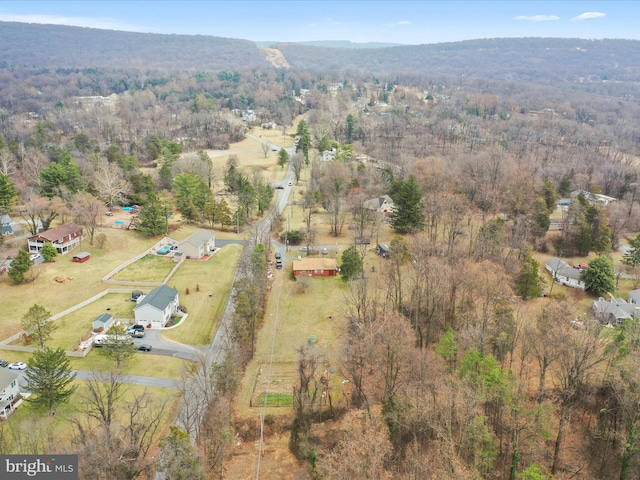 drone / aerial view with a rural view and a wooded view