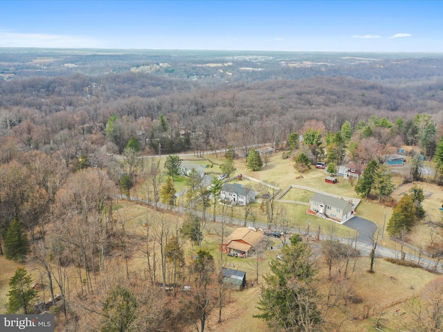 bird's eye view featuring a rural view and a forest view