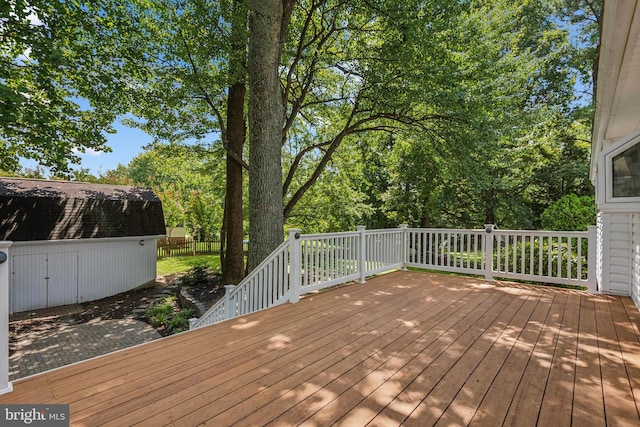 wooden terrace with an outdoor structure