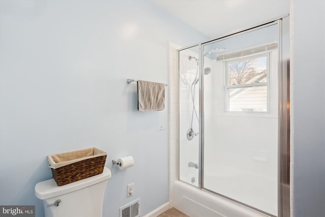 full bath with visible vents, enclosed tub / shower combo, and toilet