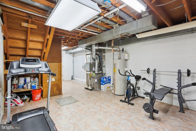 workout area featuring gas water heater and heating unit