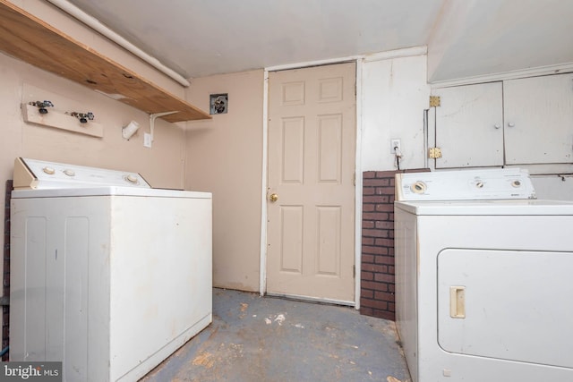 washroom with separate washer and dryer and laundry area