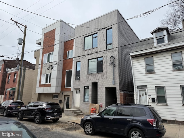 view of property with brick siding