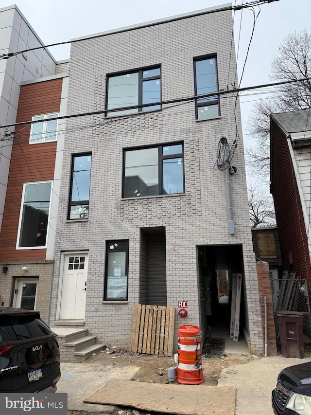 view of property with brick siding