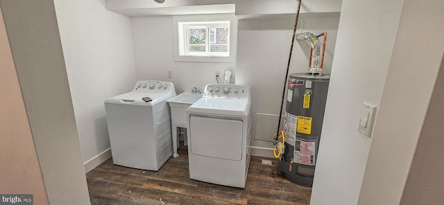 laundry room with baseboards, dark wood finished floors, gas water heater, laundry area, and independent washer and dryer