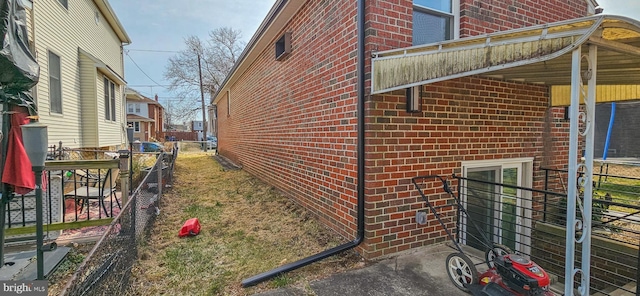 view of side of property with brick siding