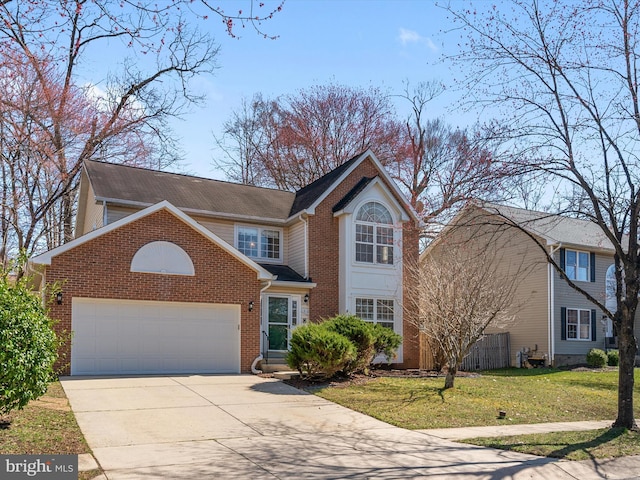 traditional-style home with brick siding, an attached garage, driveway, and a front yard