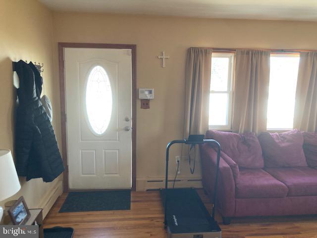 foyer entrance with wood finished floors