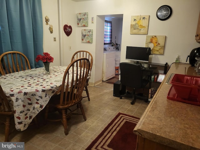 dining room with washing machine and clothes dryer