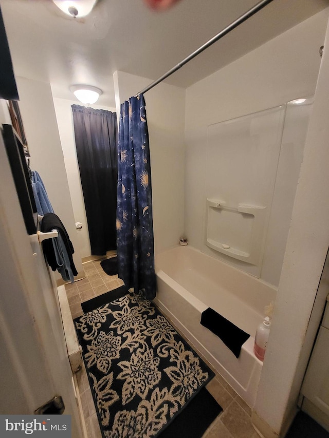 bathroom featuring tile patterned flooring and shower / bath combo with shower curtain