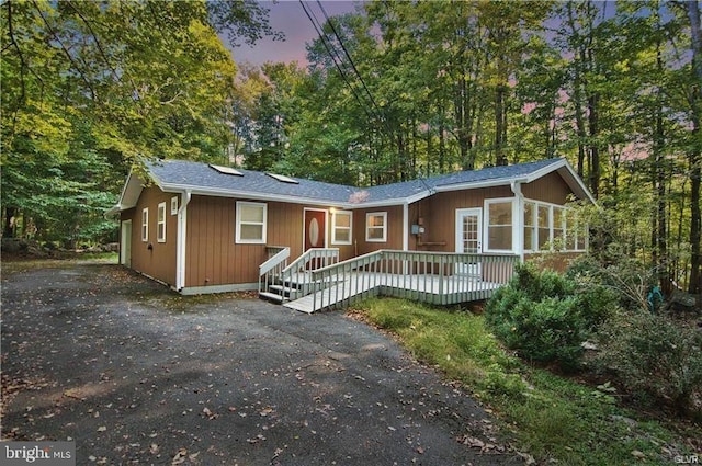 view of front facade featuring a wooden deck