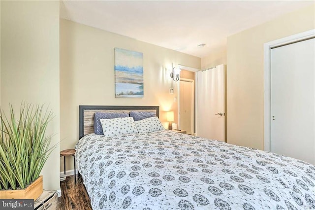 bedroom featuring dark wood-style floors