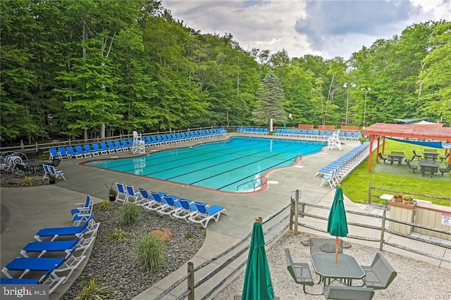 community pool featuring fence