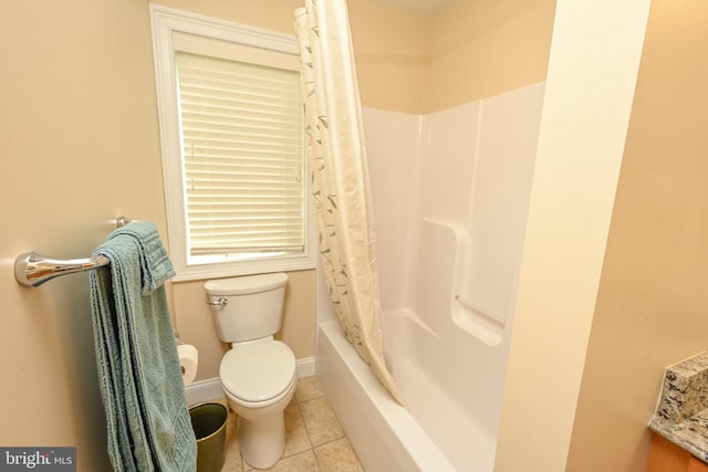 full bath with tile patterned floors, baseboards, toilet, and shower / tub combo