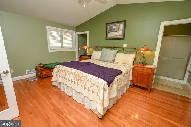 bedroom with ceiling fan, light wood-type flooring, baseboards, and vaulted ceiling