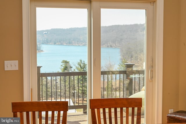 doorway to outside with a water view