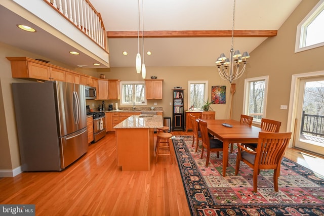 dining area featuring high vaulted ceiling, an inviting chandelier, recessed lighting, light wood-style floors, and beamed ceiling